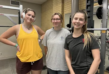 [Image] Bowman siblings stand with Y fitness instructor, Hayley