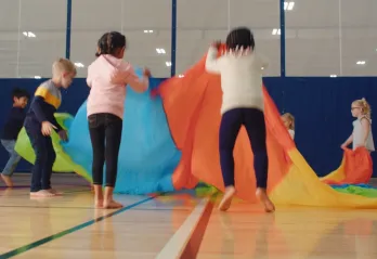 A group of children playing at a Y Day Camp. 