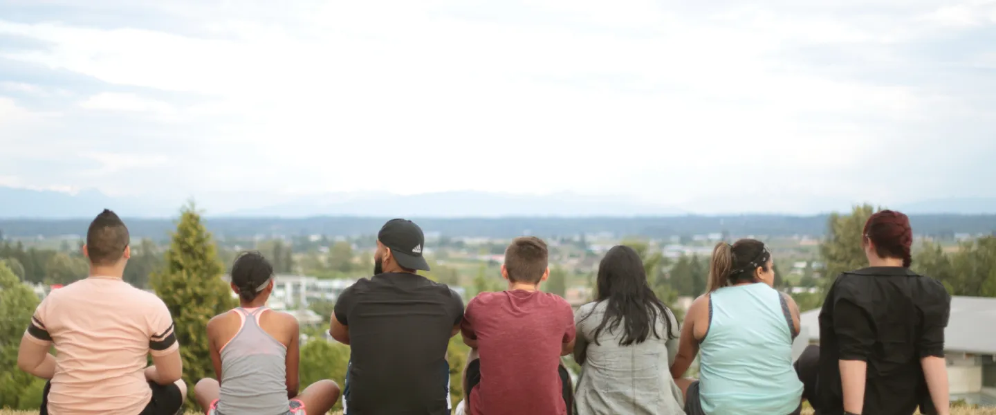 Young Adults Sitting and Looking at the Horizon