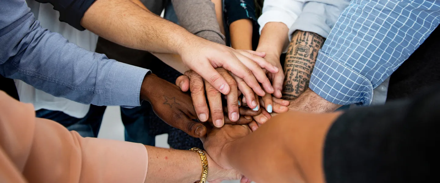 Circle of People Stacking Hands