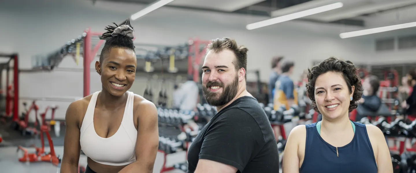 [Image] 3 smiling people in fitness centre