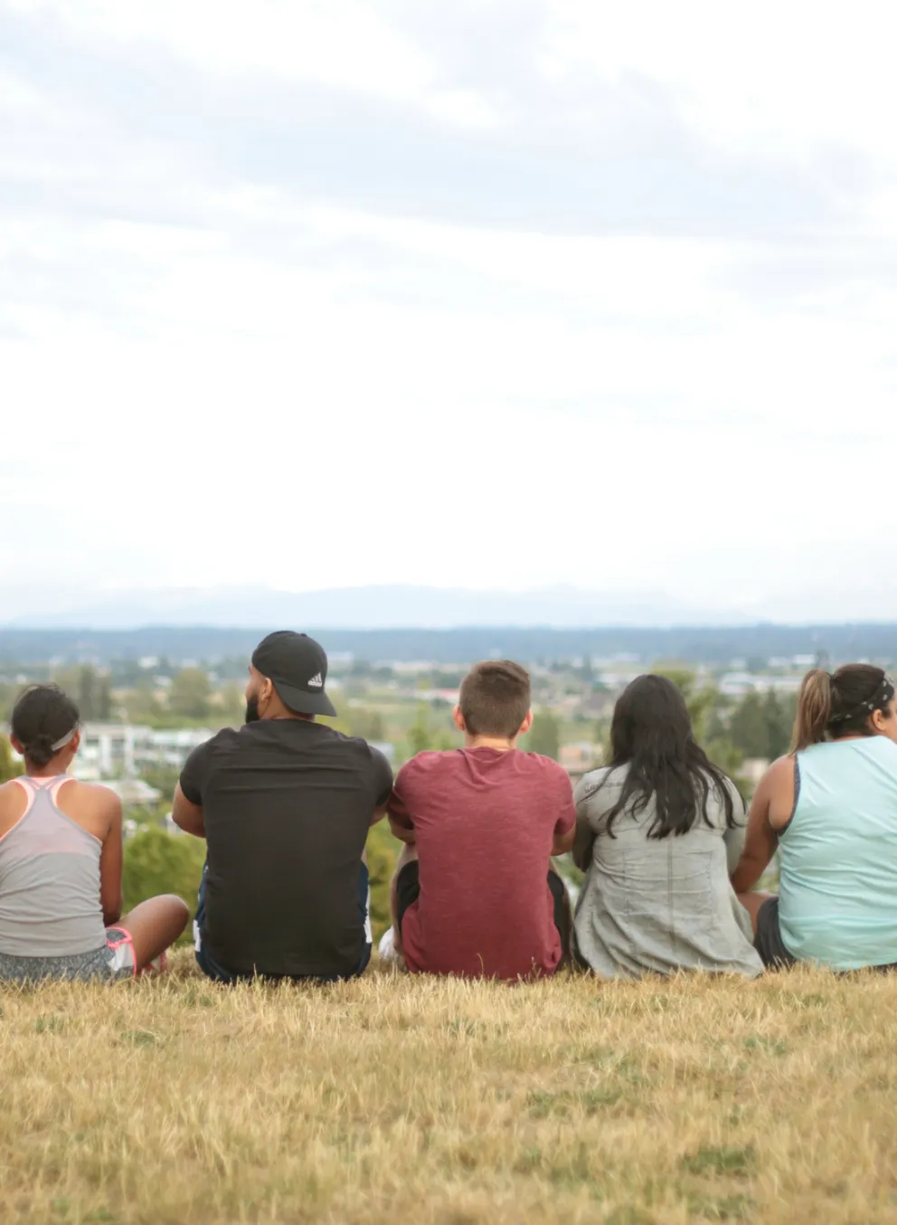 Young Adults Sitting and Looking at the Horizon