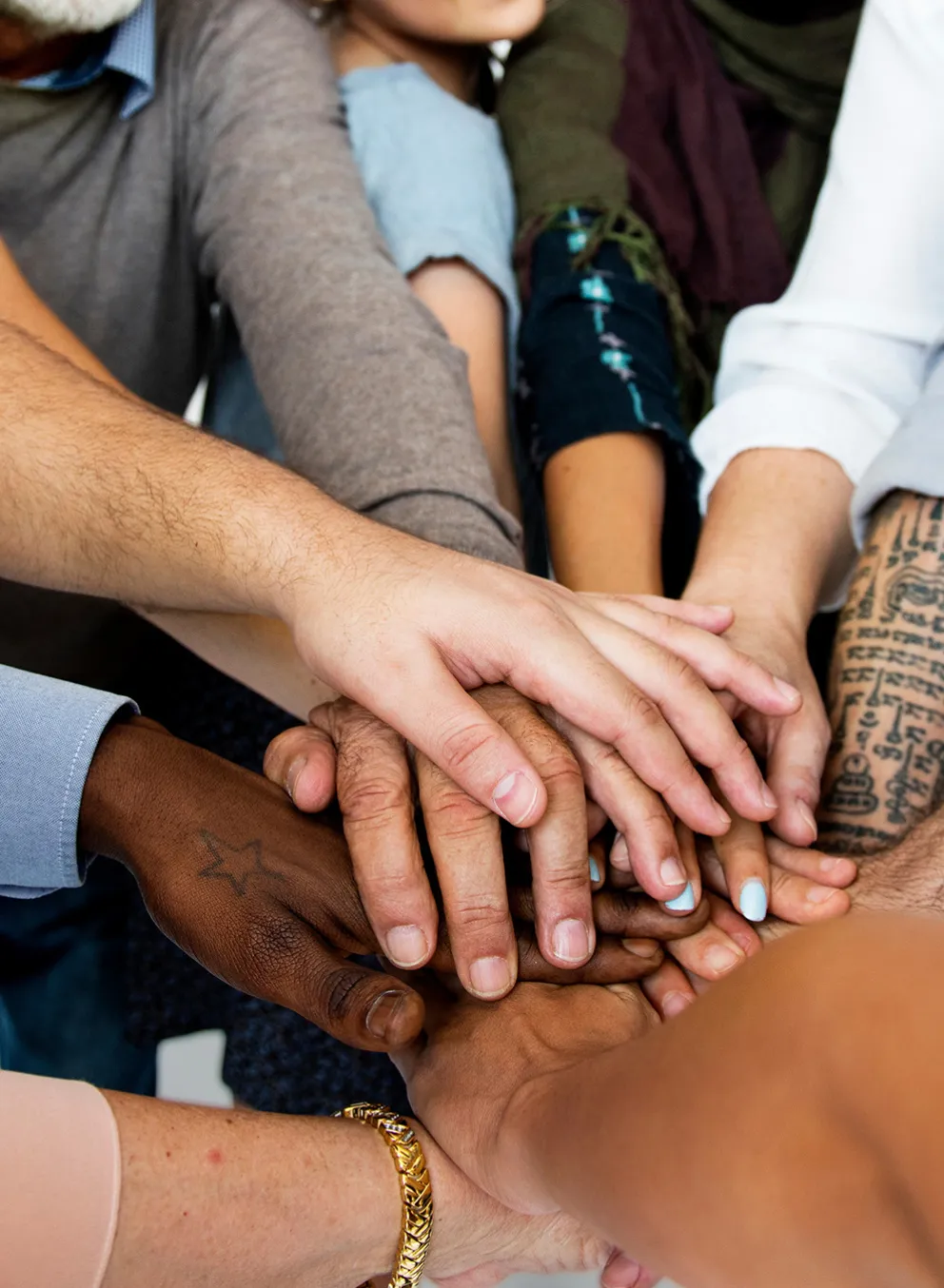 Circle of People Stacking Hands