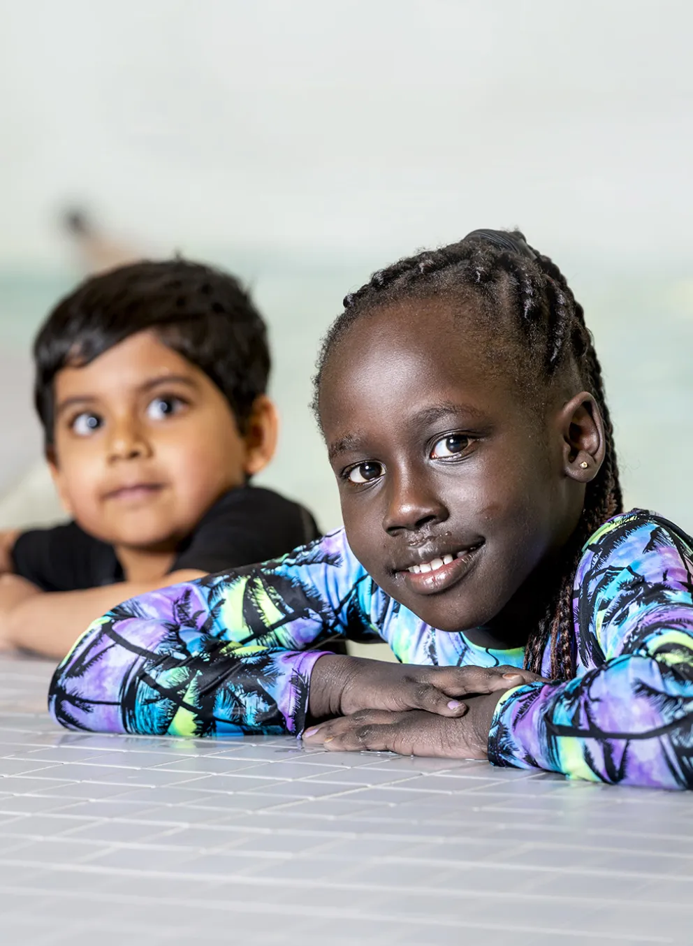 Two Children Learning to Swim