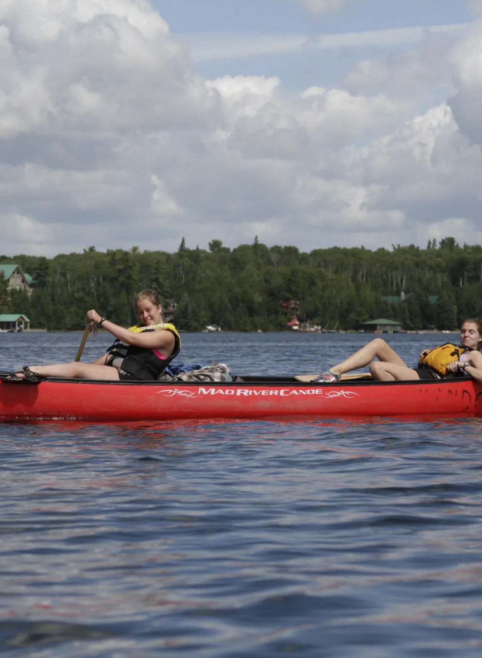 older teens in a canoe on the water