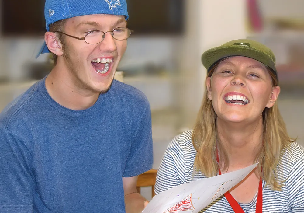 Teen Laughing with Program Staff