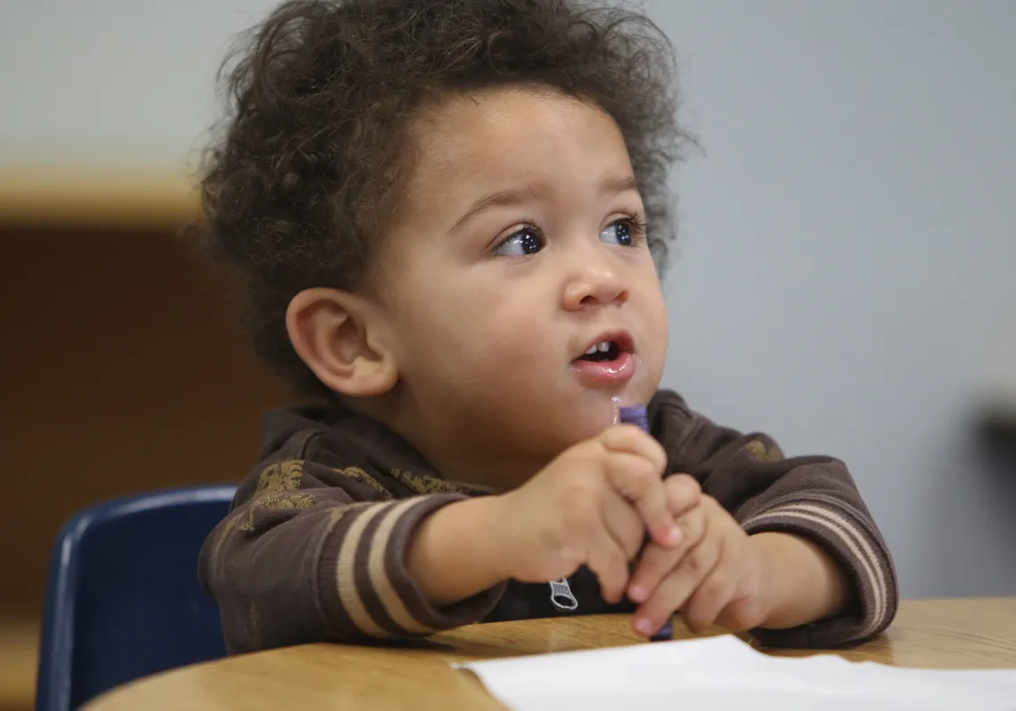 Infant Boy with Crayon