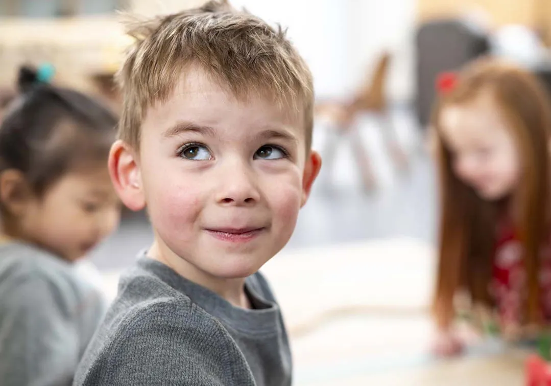 Young Boy Playing with Two Friends