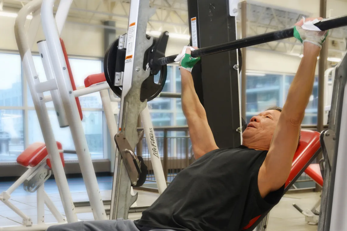 Man Lifting Weights at Downtown Y