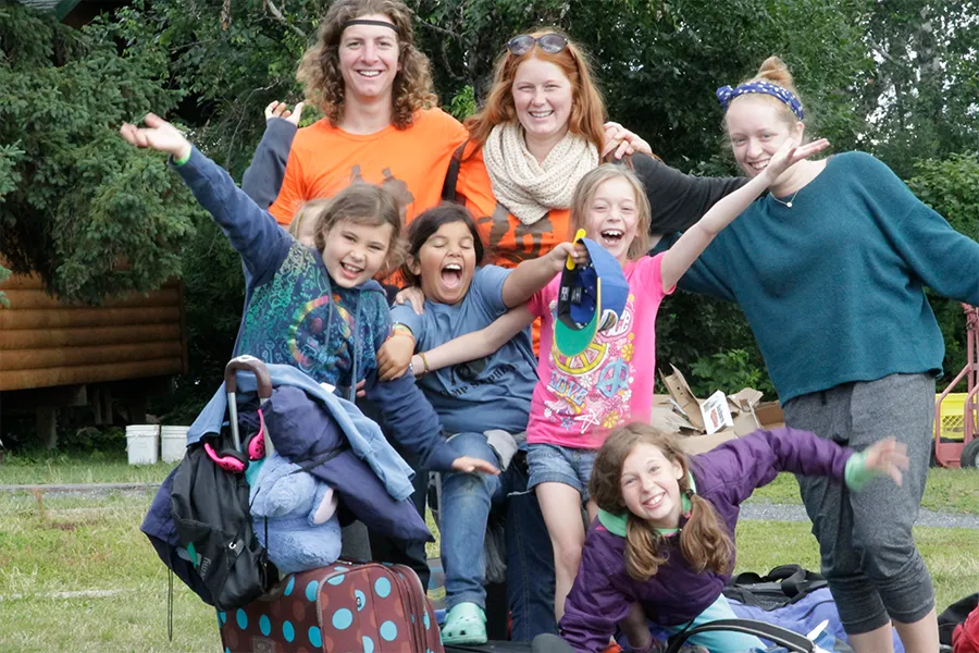 laughing counsellors with young campers