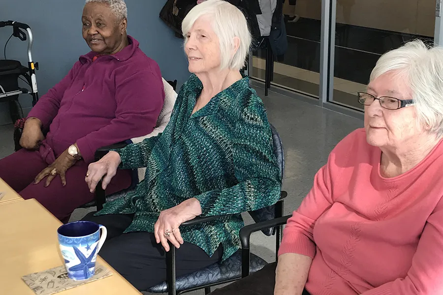 Image of three senior women sitting at a table