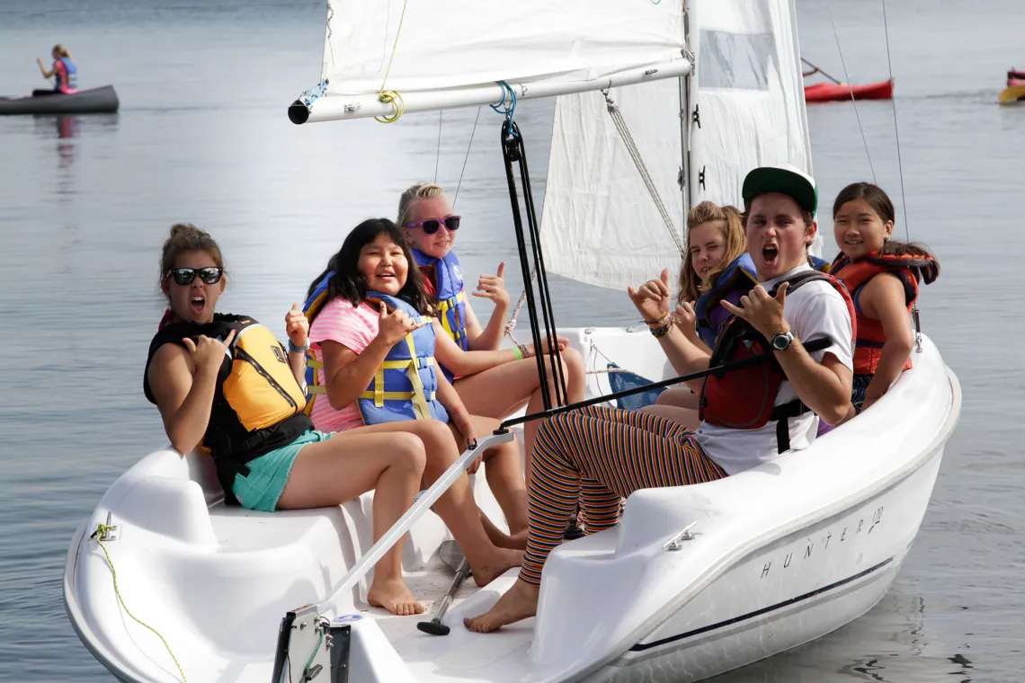 Campers in a sailboat