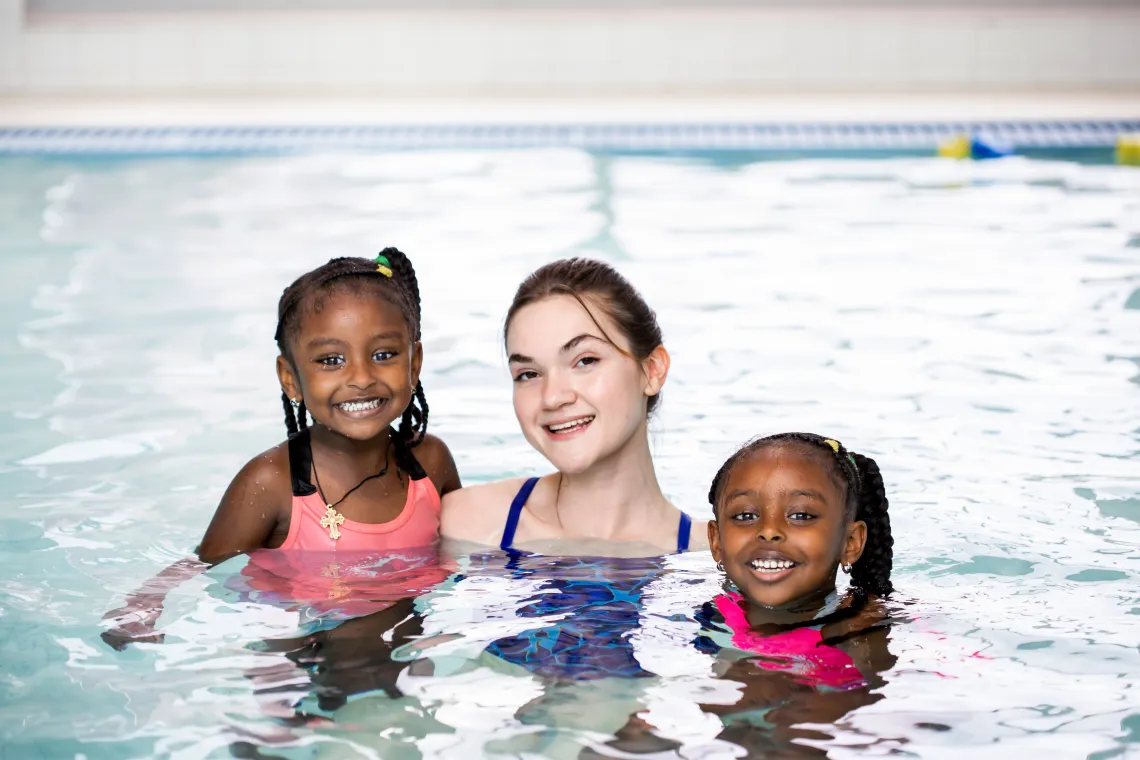 Image of swim instructor with two girls in a pool